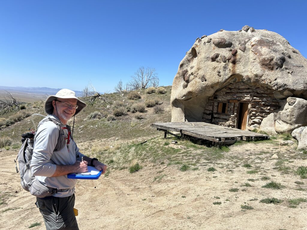 A UCSS steward monitoring a site with a smile